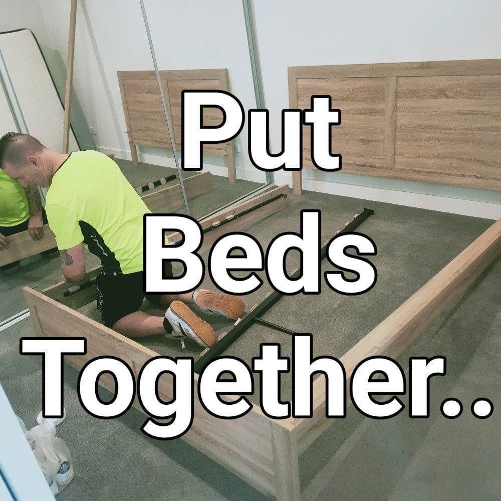 Careful Movers assembling a bed