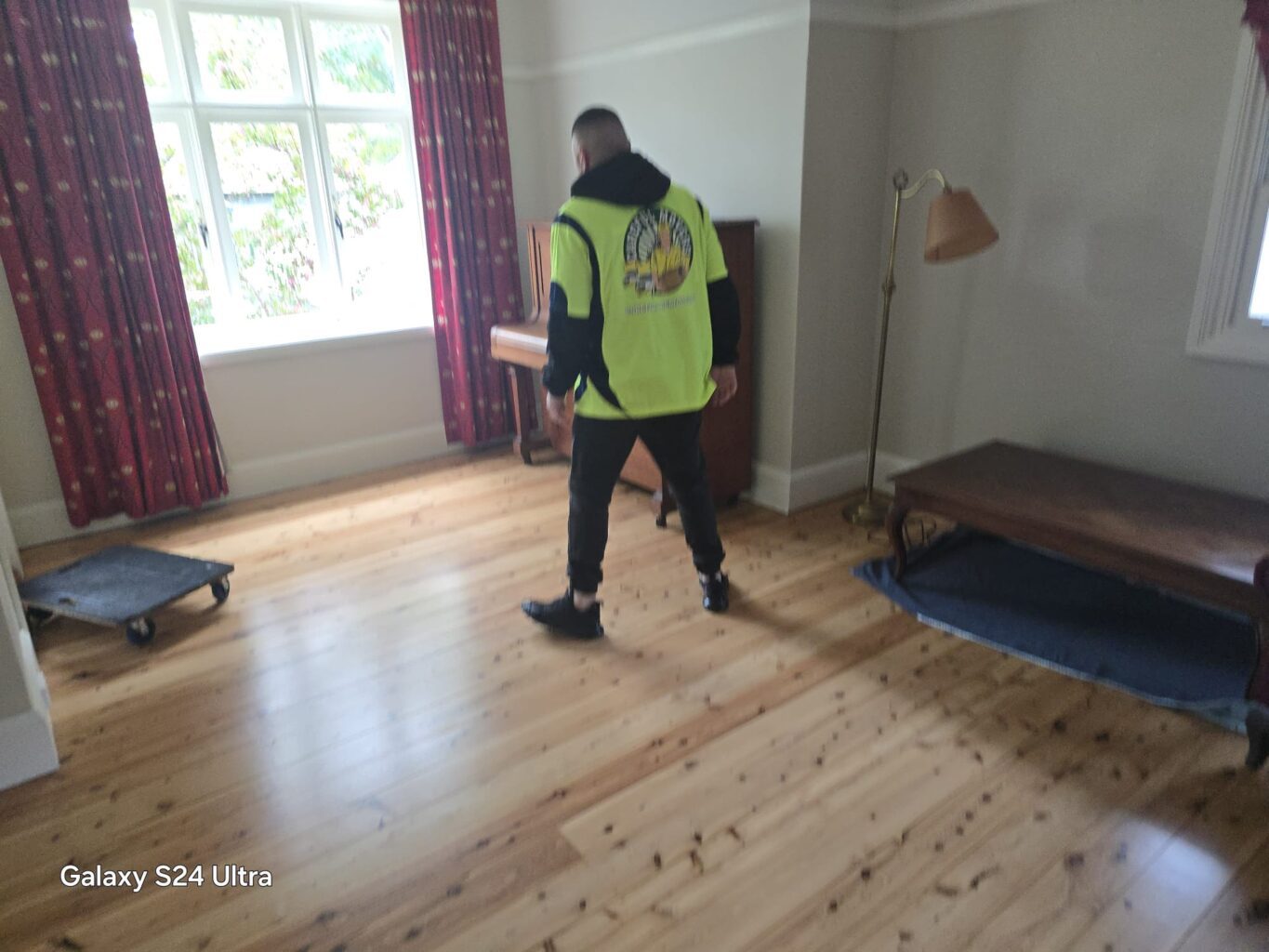 Piano positioned safely away from the floor sanding work area
