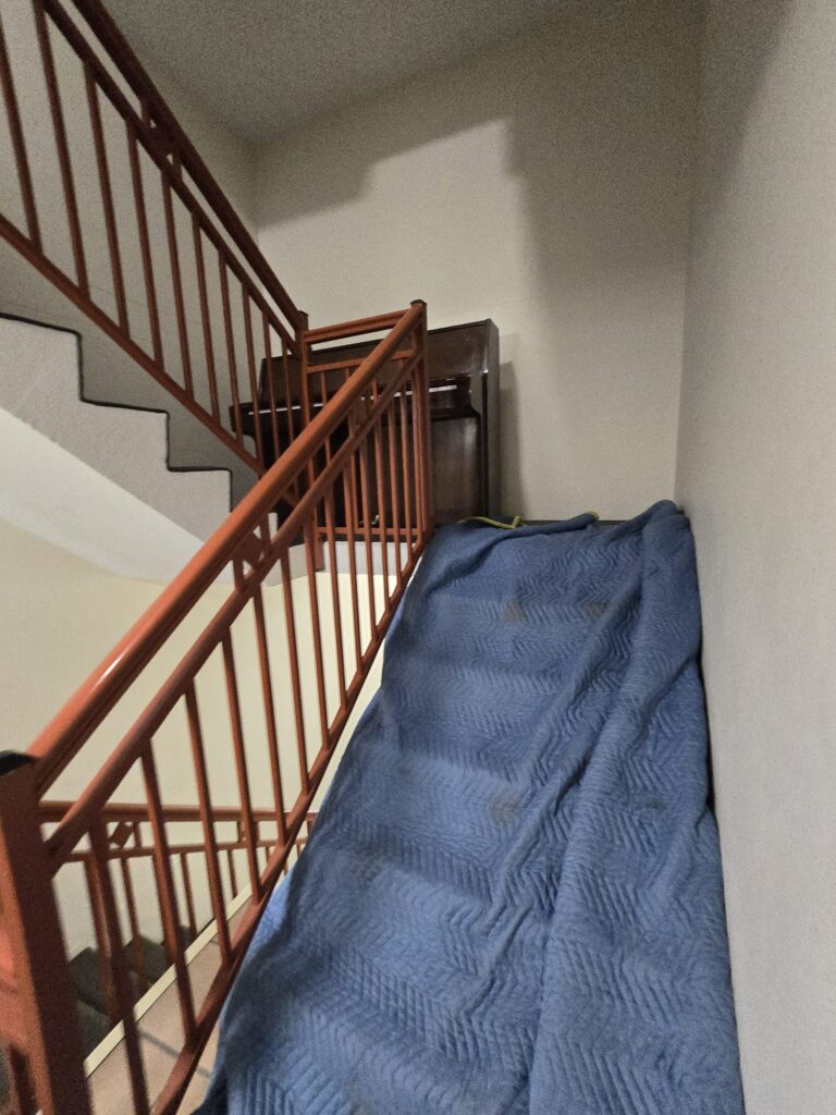 Moving blankets protecting a staircase before furniture is moved