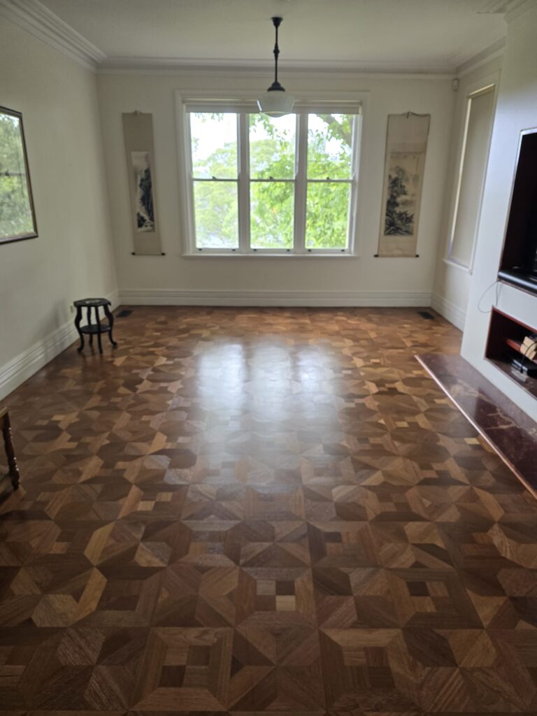 Protective blankets ready before furniture returns to a premium floor