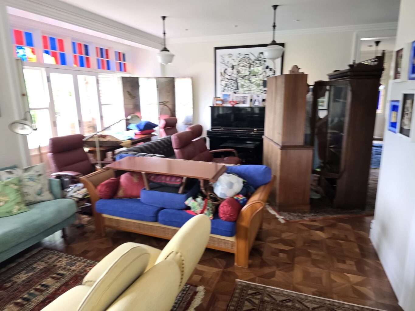 Furniture moved into a temporary room before floor sanding