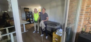 Careful Movers setting up lifting ropes inside a Hornsby unit
