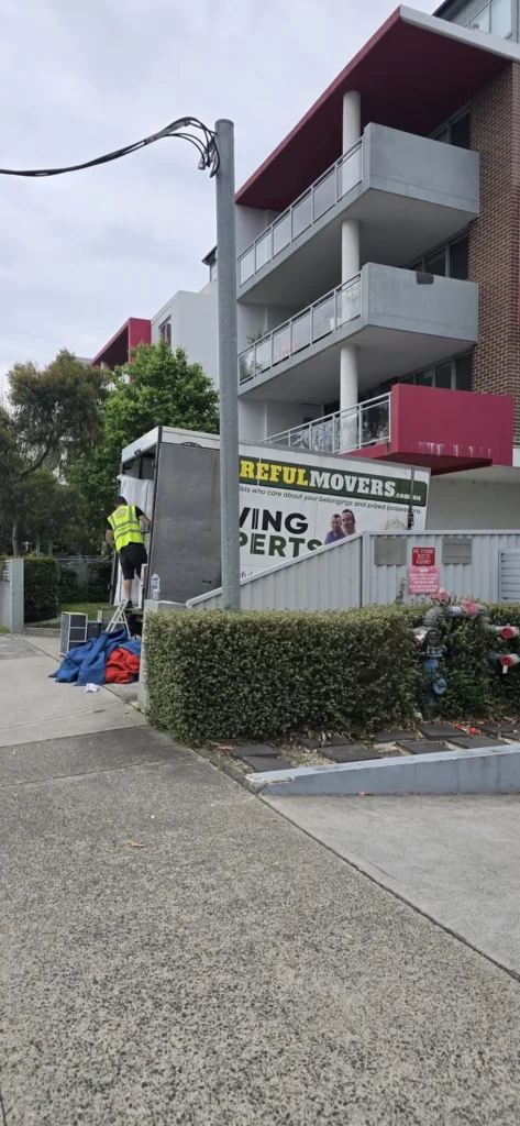 Careful Movers crew loading furniture at a Hornsby unit block