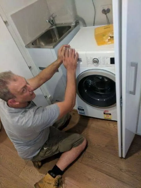 Careful Movers connecting a washing machine after a Hornsby move